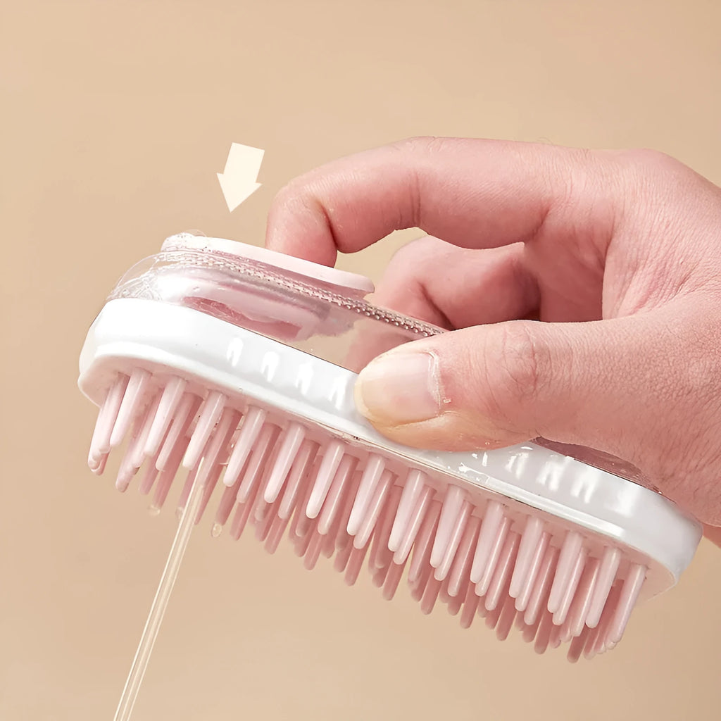 Grey silicone pet bath brush with a long handle next to a pink one, showing soft bristles for washing dogs and cats.
