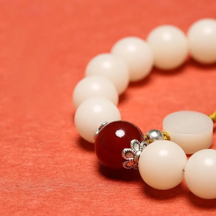 White jade Bodhi couple bracelet with 10mm round seeds in obsidian, red stone, and red code brain colours