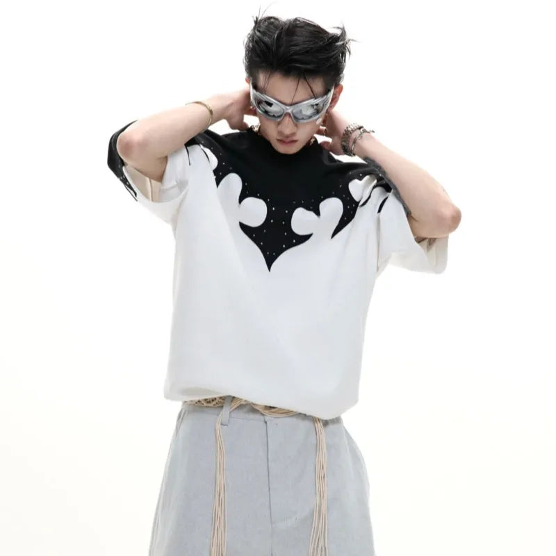 Men's grey cotton T-shirt with burnt flower stitching and rhinestone details on the front, showing loose fit and drop-shoulder sleeves.