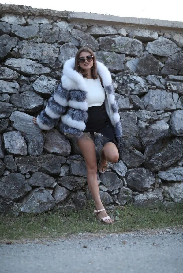 Loose-fitting women's hooded coat in artificial fur, shown in brown and silver fox colours.