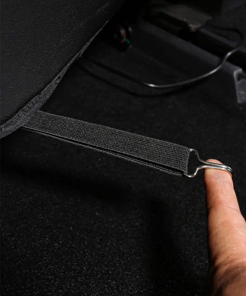Two black leather rear seat anti kick pads measuring 68cm by 42cm for car seat back protection