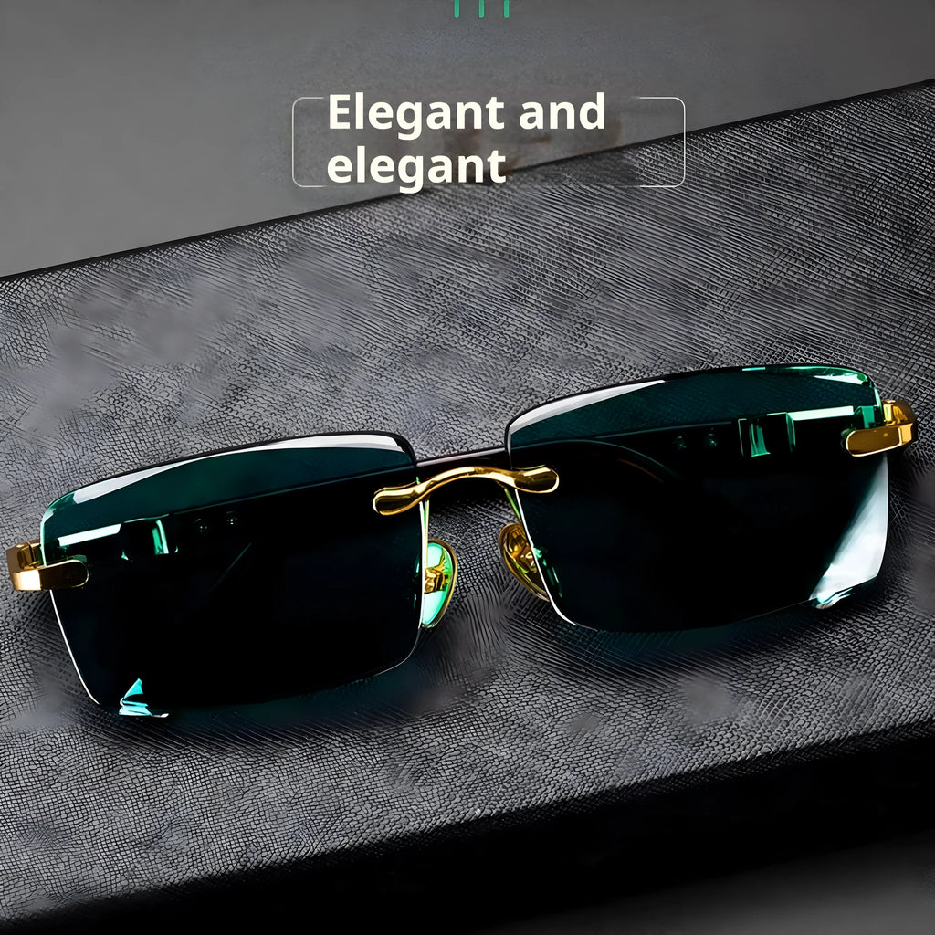 Frameless sunglasses with dark green crystal lenses showing a decorative wealth attracting pattern.