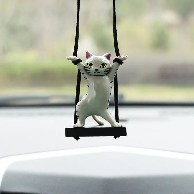 Cartoon-style resin cat pendant for car interior decoration in one of five colour options.