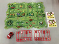 Children puzzle electric railroad speeder with automatic car and dinosaur-themed puzzle track pieces on floor