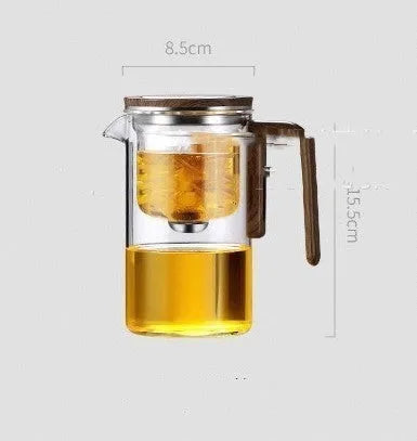 Glass teapot with wooden handle showing magnetic separation button and inner filter basket.