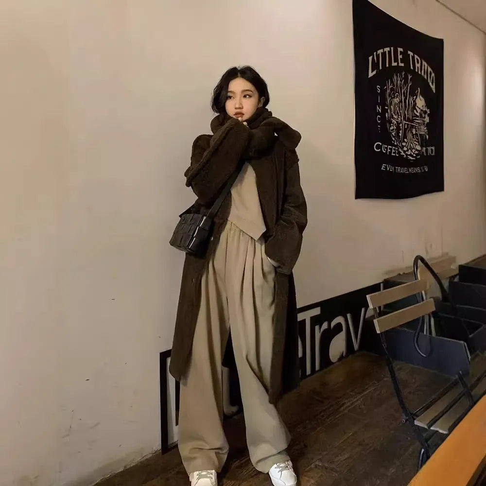 Women's loose khaki casual sports suit set with long sleeves and trousers on a hanger.