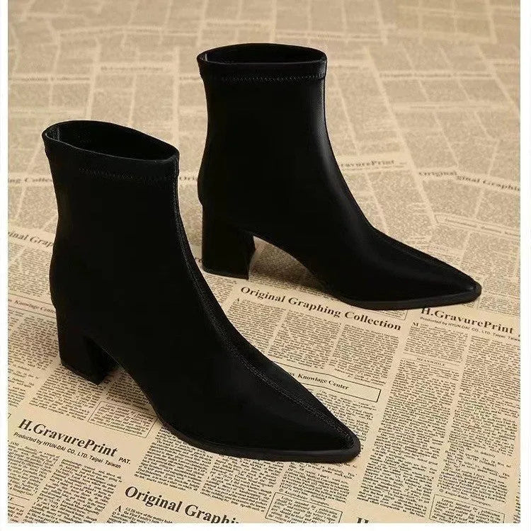 Women's khaki pointed toe Martin boots with a wedge heel and stretch artificial velboa upper.