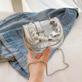 PU women's crossbody bag with laser pearl finish in silver colour showing horizontal square shape and shoulder strap