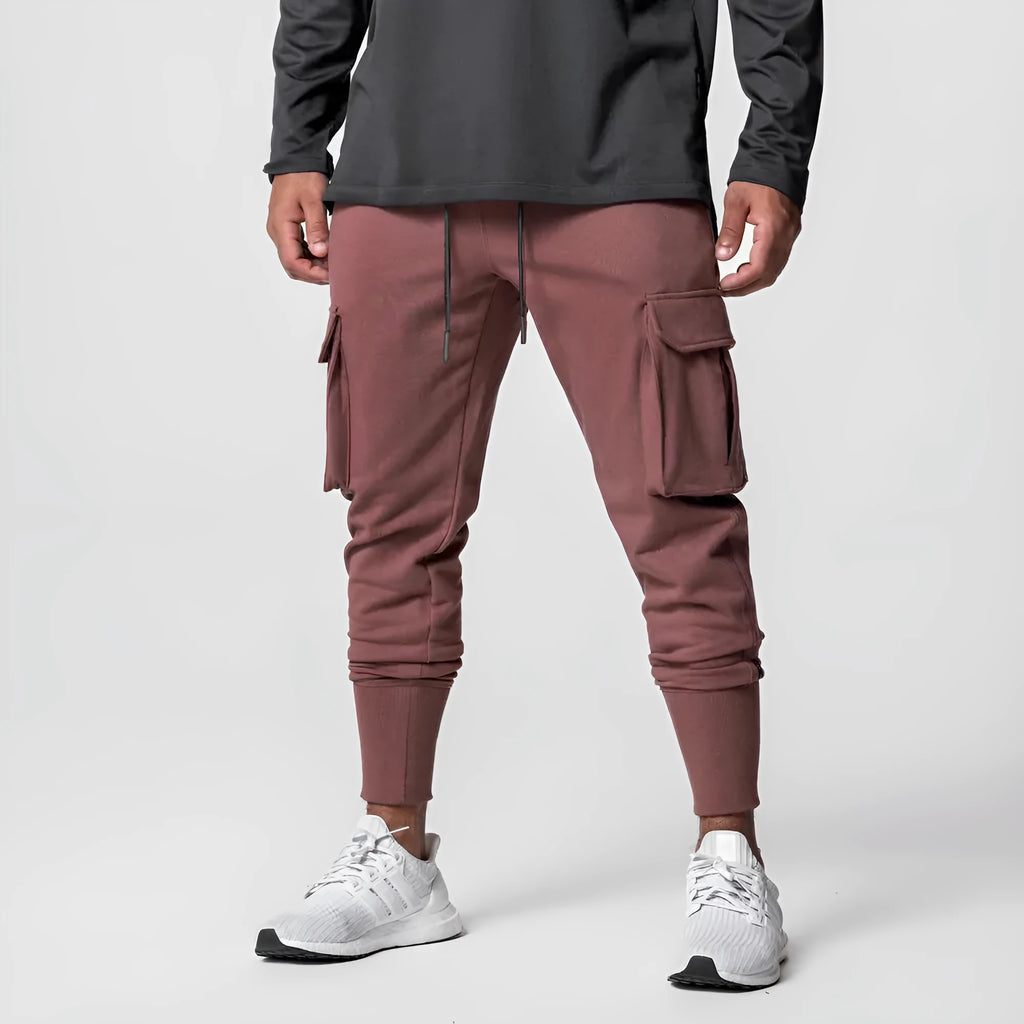 Slim fit multi-pocket cargo pants in cotton with polyester lining, shown in classic black, dark grey, army green, rust red or milky white.