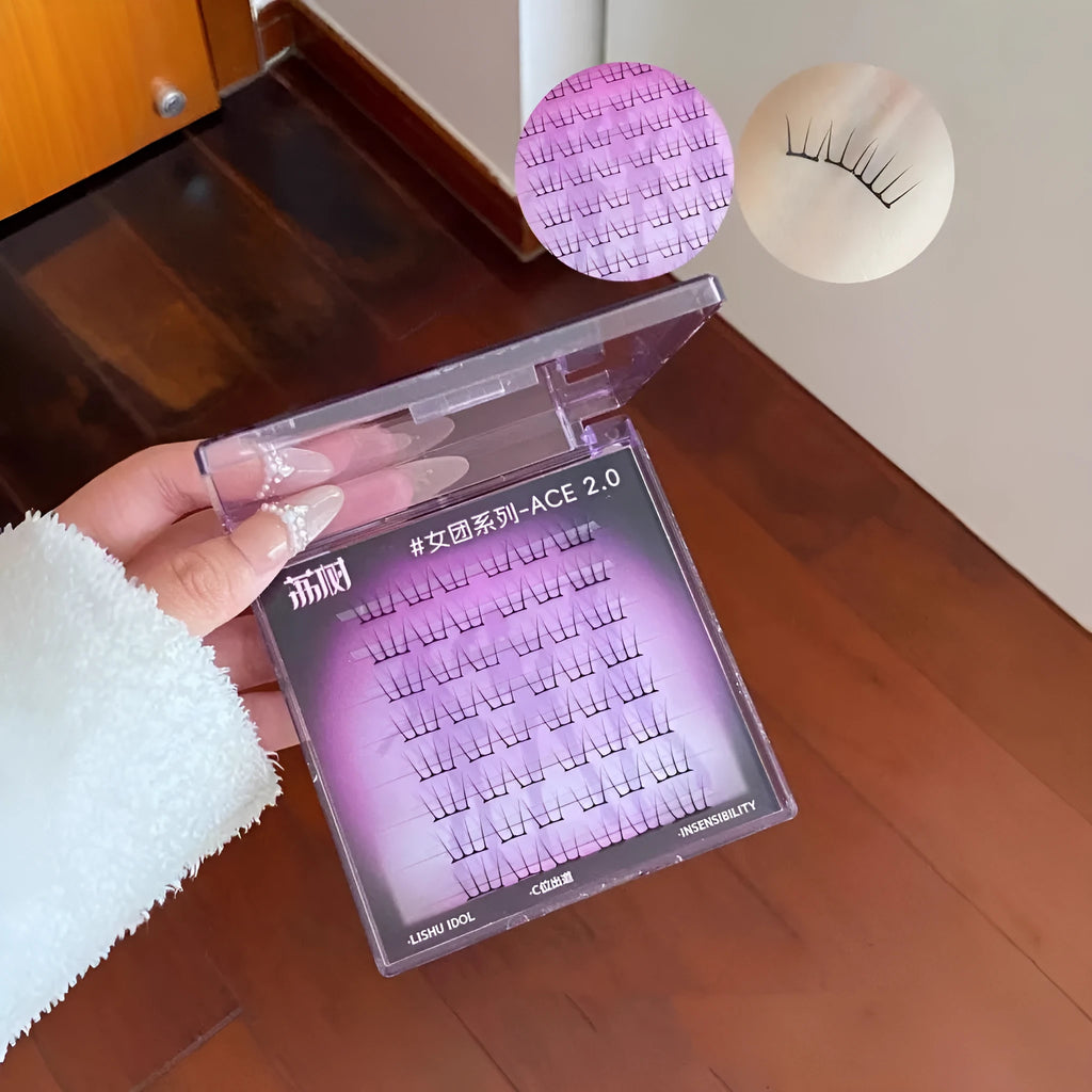 Reusable artificial fibre false eyelash clusters shown in packaging with optional tweezers and glue