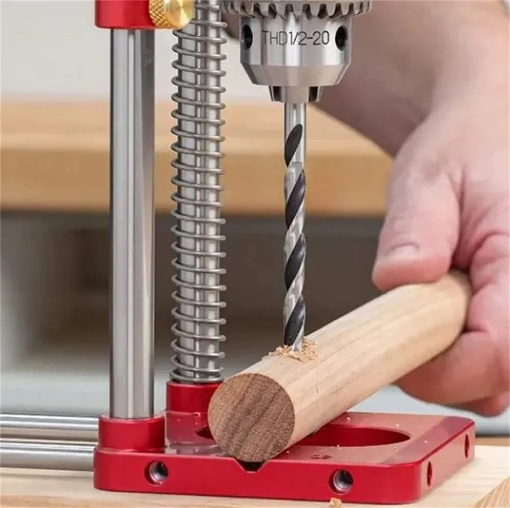 Woodworking drill locator with metal body and red or black plastic section for use on wood
