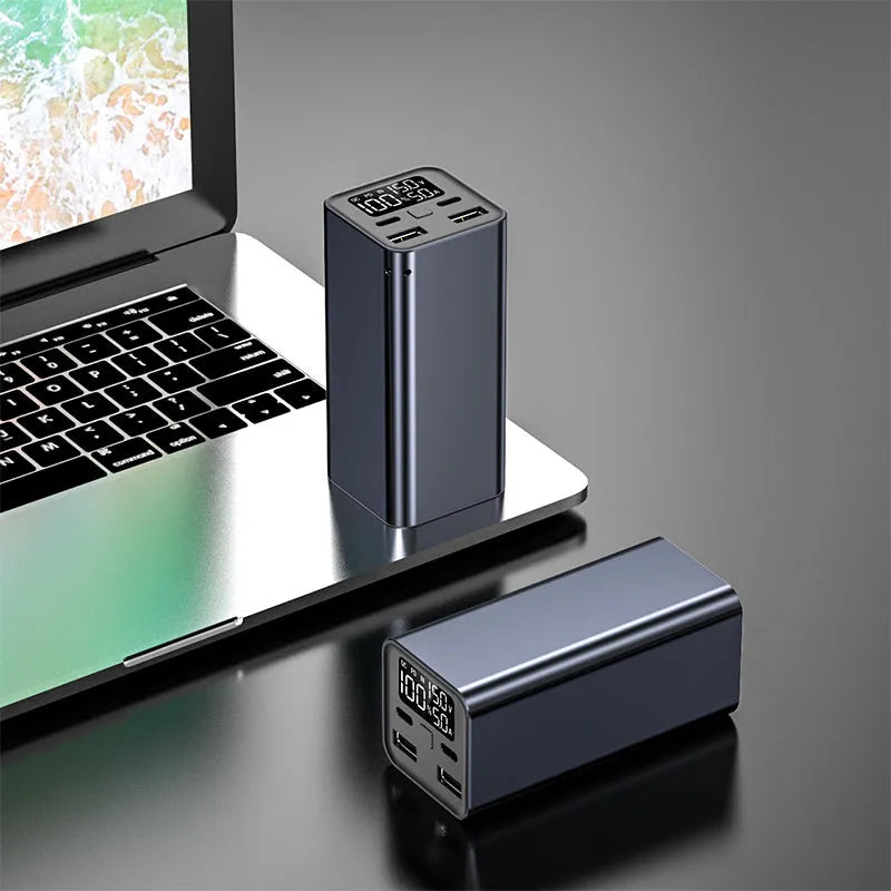 Black 65W metal power bank showing USB-C port, with dimensions 47.5x104.5x47.5mm.