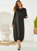 A loose black lantern dress with a lace-up crew neck, showcasing its casual knitted pullover style.