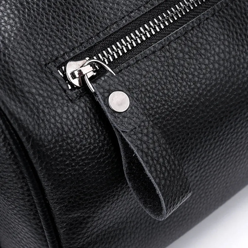 Black genuine leather women's crossbody bag with one shoulder strap showing large capacity dimensions