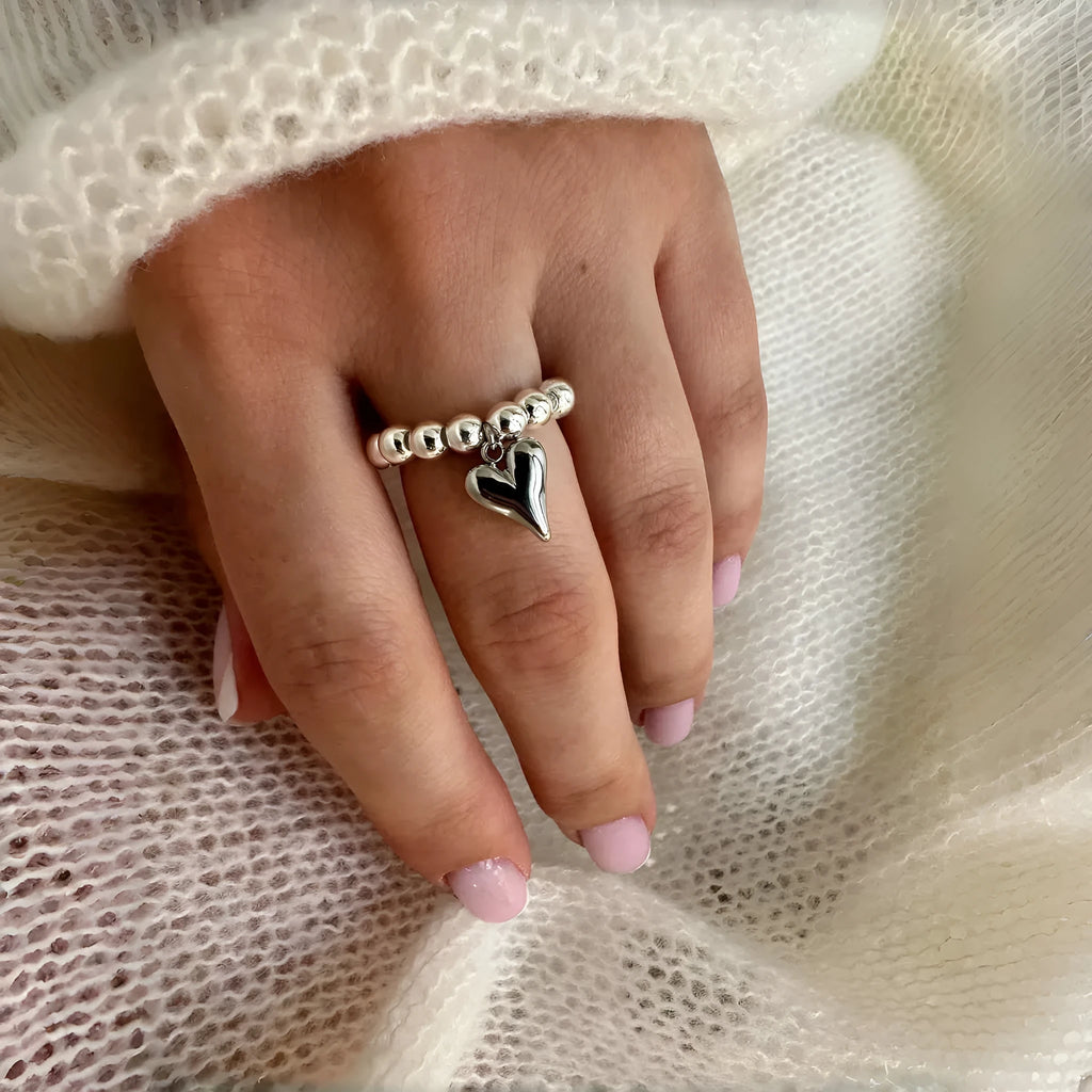 Handmade beaded elastic string love ring with geometric heart design in gold electroplated finish