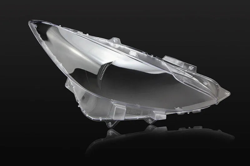 Mazda 3 Exela replacement headlamp cover with tube of snake glue adhesive.