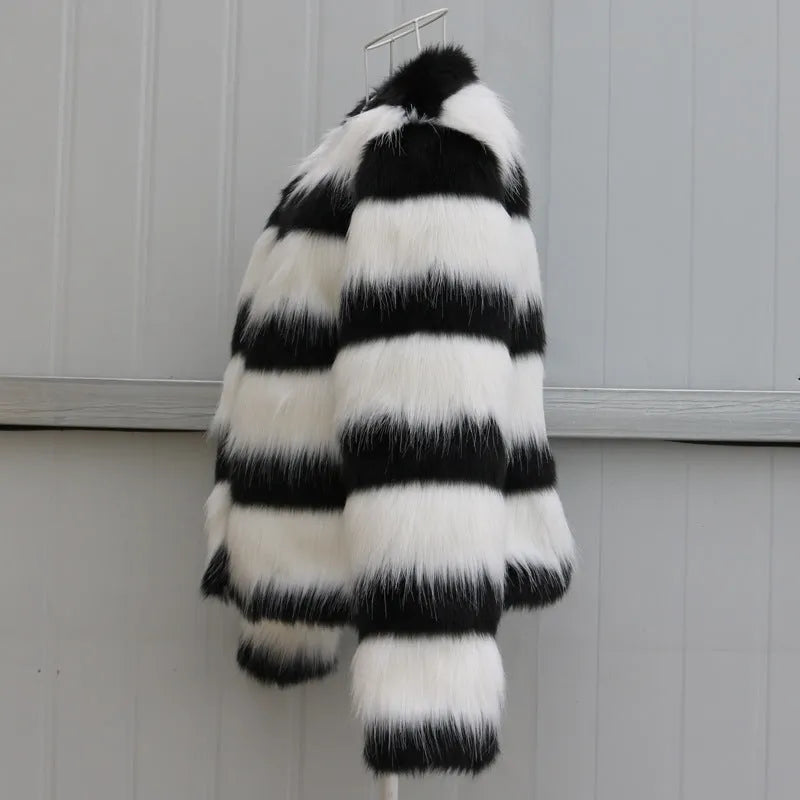 Women's black and white striped faux fur leather jacket with regular sleeves.