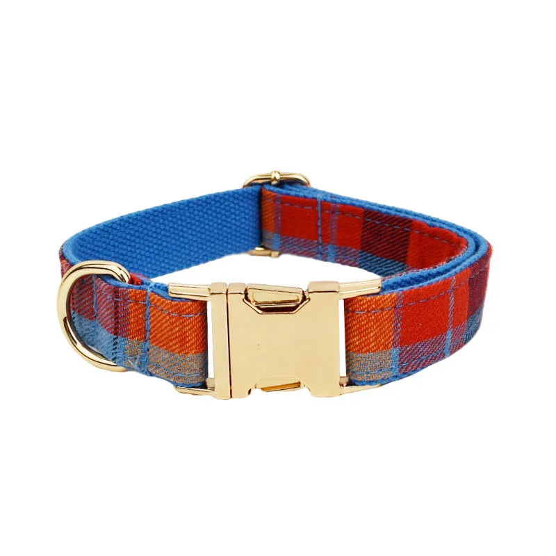 Blue velvet plaid cloth dog collar and matching leash set on a neutral background