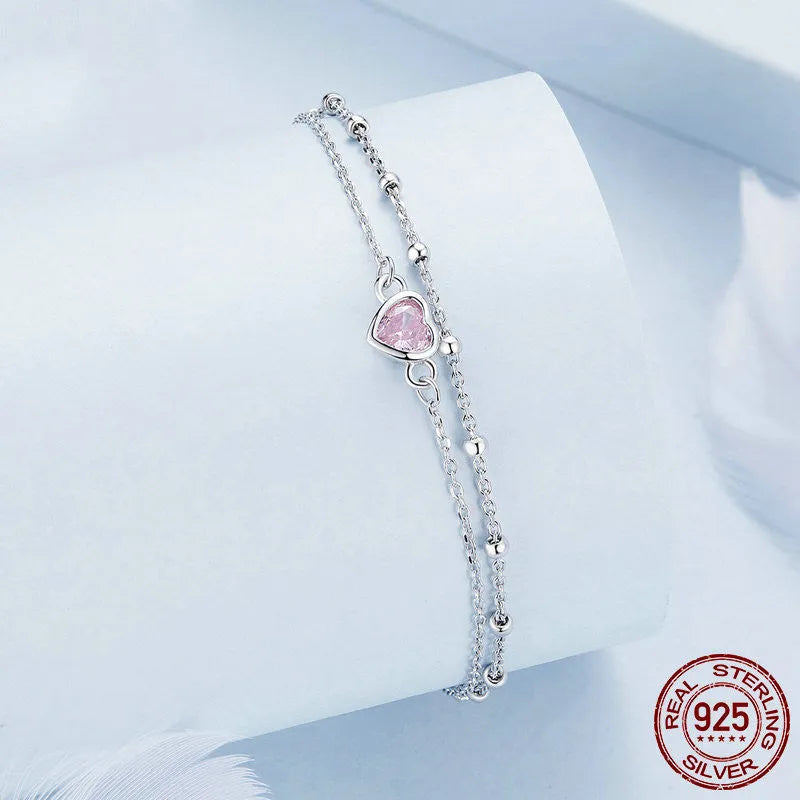 Sweet style sterling silver bracelet with small heart pendant on an adjustable chain.