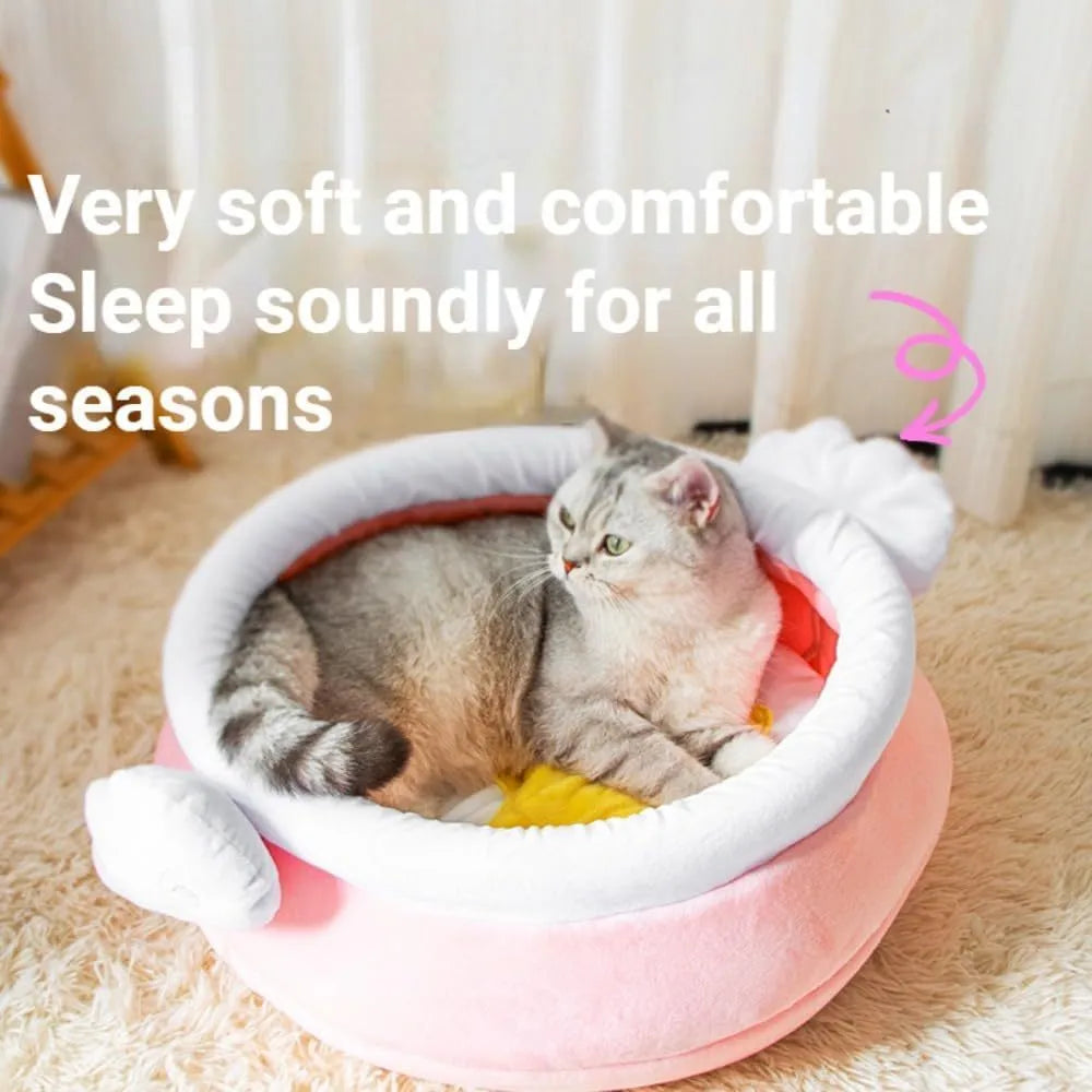 A pink magic honey pot shaped cat sofa bed with a soft interior for a small pet.