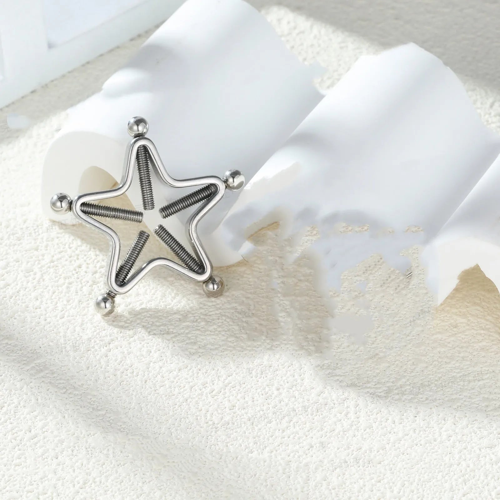 Stainless steel screw adjustable nipple ring in geometric shape, steel colour finish