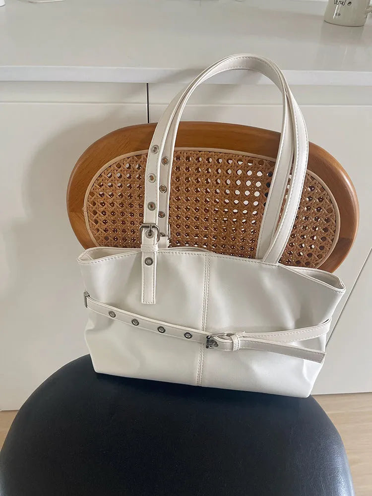 Women's large capacity PU shoulder bag in black with visible sewing line detail and horizontal square shape