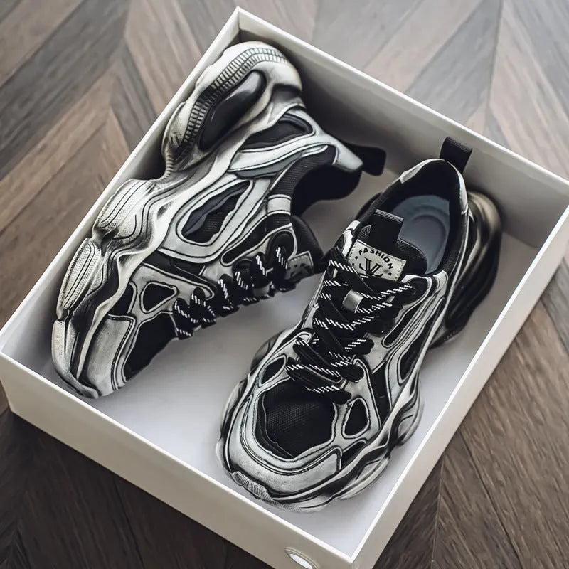 Men's black mesh sneakers with a lace-up front, platform sole, and cross strap detail on a white background