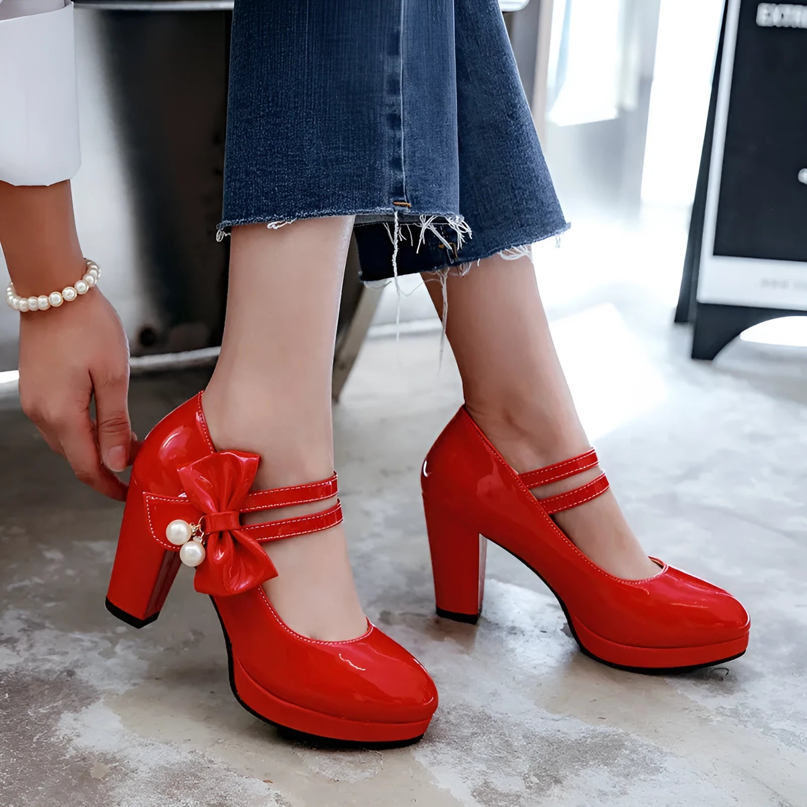 Red waterproof platform shoes with a thick chunky heel, round toe, and buckle fastening on the side.