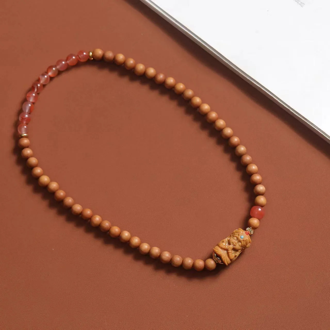 Brown sandalwood bracelet with South Red Zachilam patterns and 6mm round wooden beads