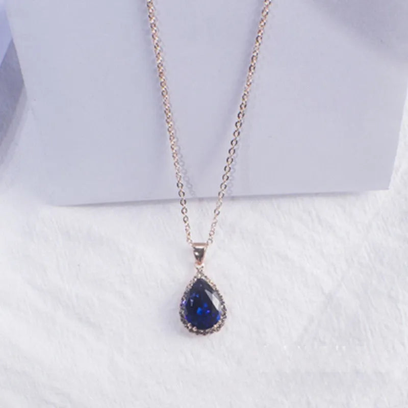 Geometric drop shape alloy necklace with rhinestone accents in rose gold pink finish