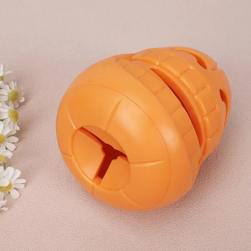 Yellow pumpkin-shaped TPR dog chew toy measuring approximately 8.6x11.5cm
