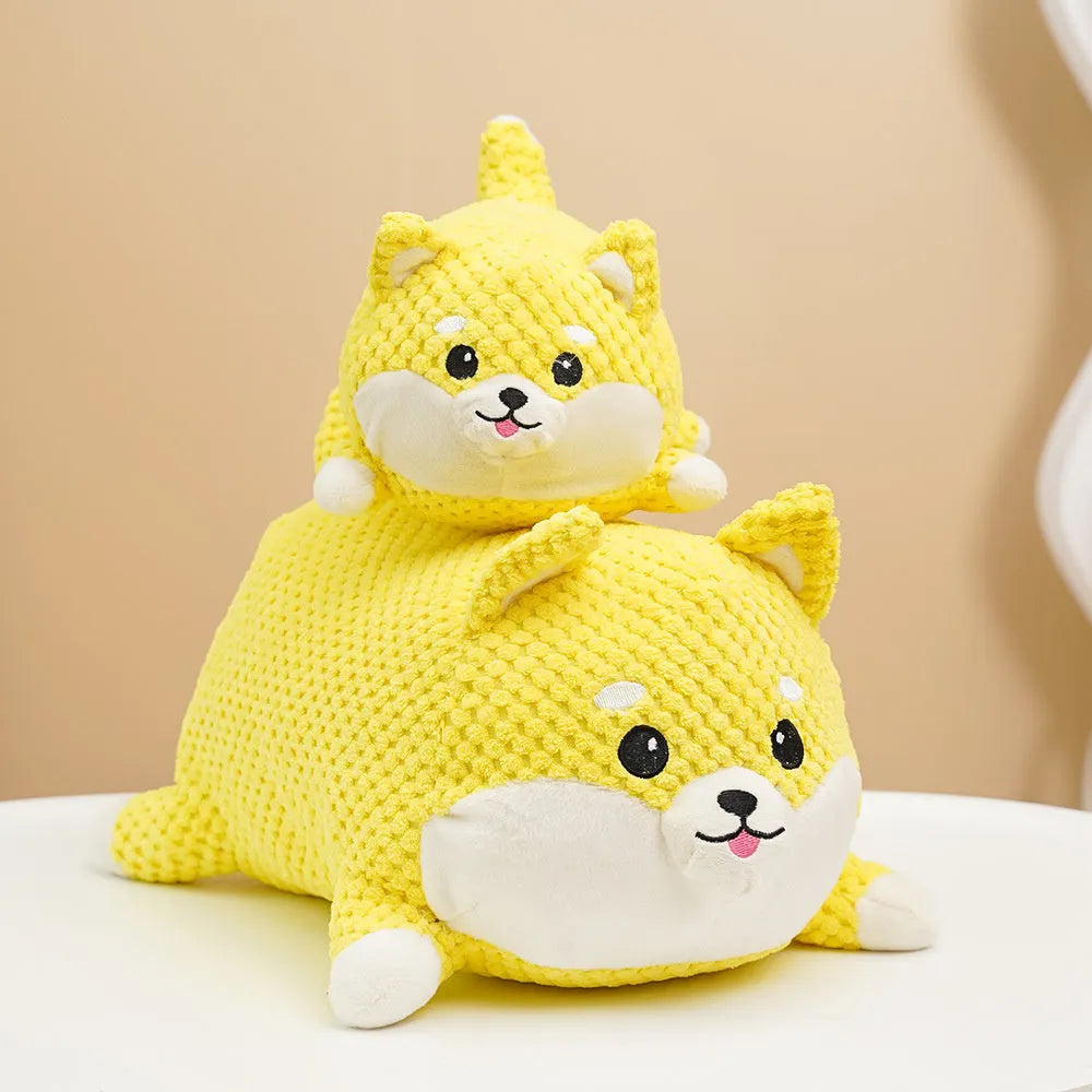 Large and medium sized plush calming dog toy with squeaker and textured chew fabric.