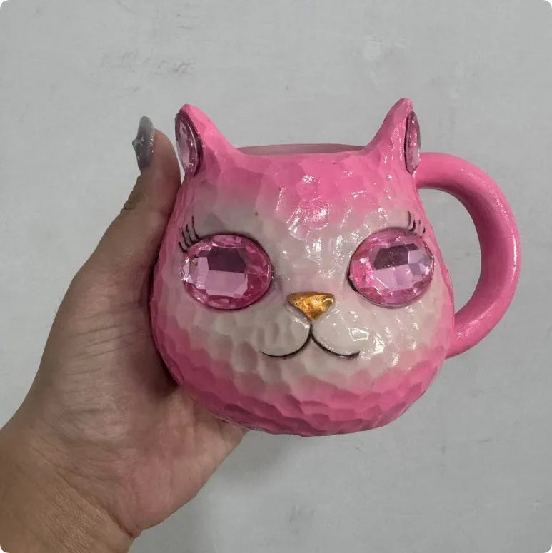 Crystal Earth globe decorative ornament on top of a colourful cat-shaped resin cup.