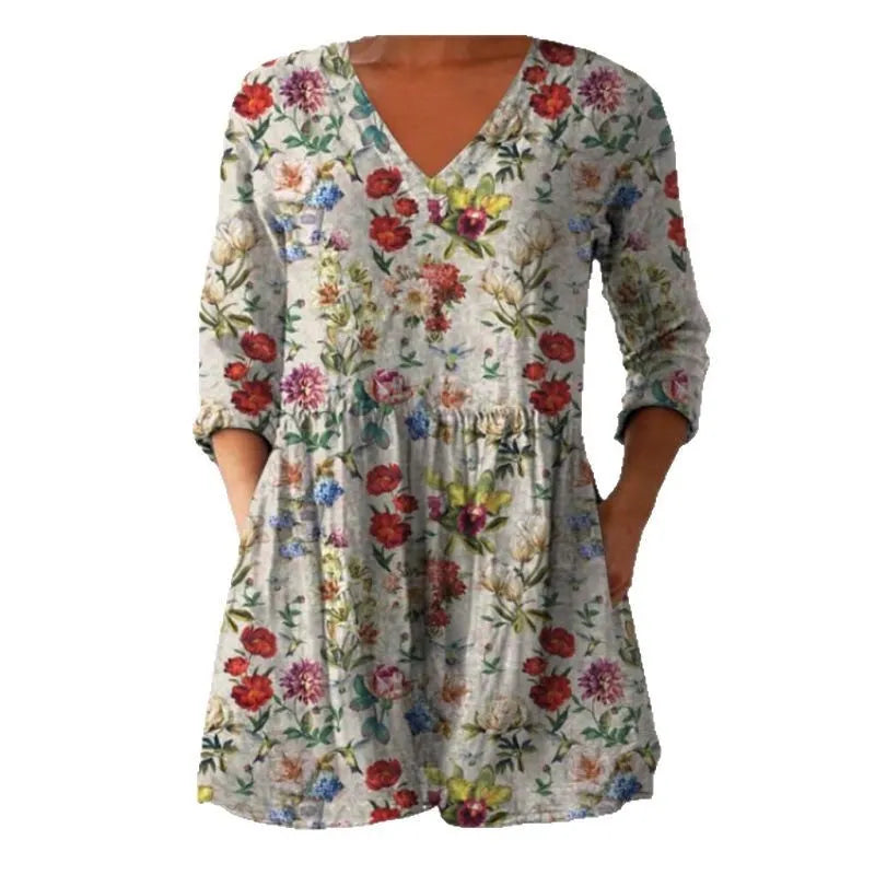 Women's loose-fitting dress with a wave print pattern, wide waist, and three-quarter length sleeves.