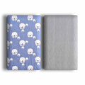 Cotton velvet pet blanket with dinosaur print in various sizes on a dog bed.