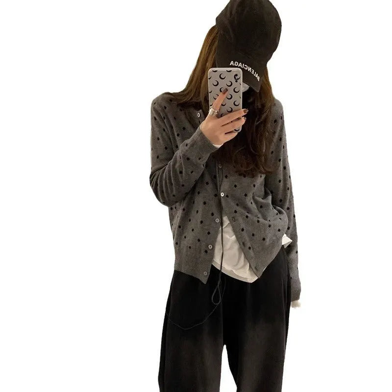 Grey Korean-style loose knitted cardigan with white crocheted flower details on the front.