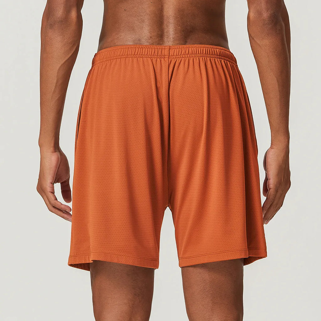 Man wearing sky green quick-drying double-layer running shorts for exercise.
