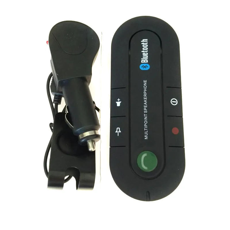 Black vehicle-mounted Bluetooth handsfree device clipped to car sun visor with aux cable