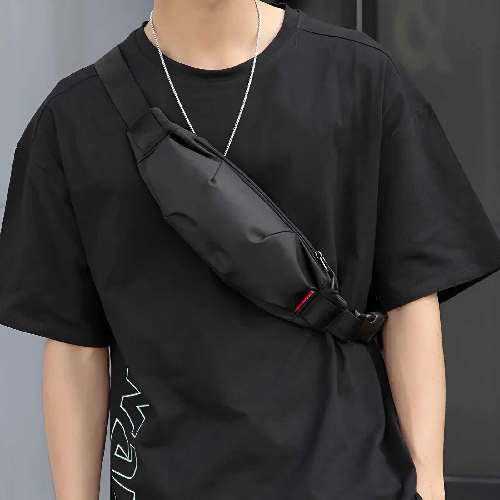 Black Oxford cloth waist pack with a phone pocket and ID pocket, shown with dimensions 12cm high by 27cm wide.