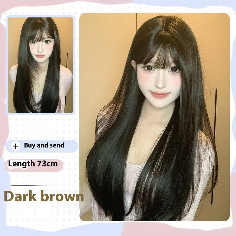 Dark brown long straight synthetic wig with bangs on a wig head.