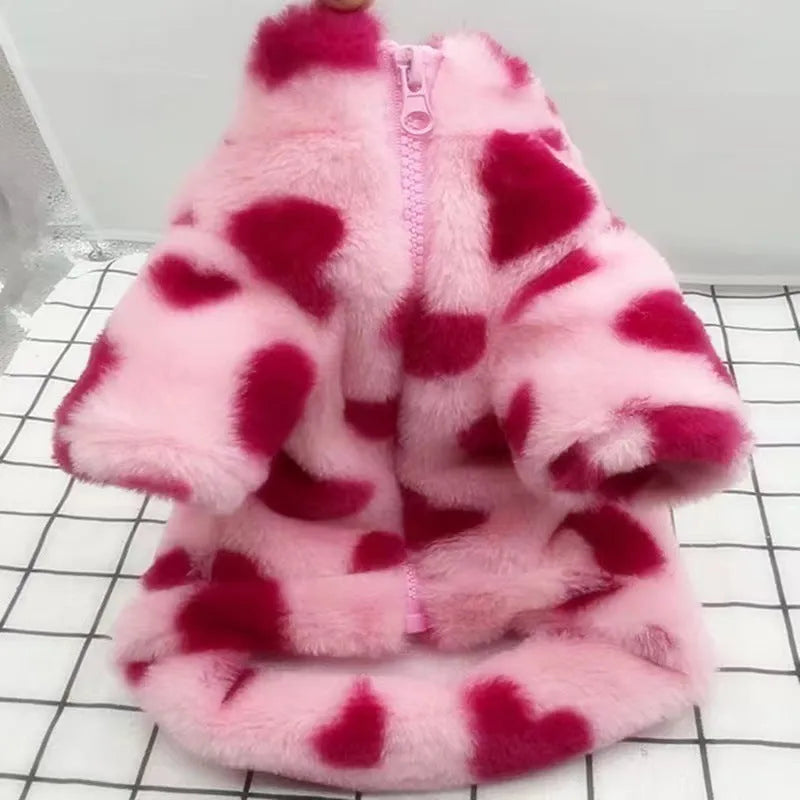 Small pink plush dog coat on a mannequin, showing British-style design for breeds like Teddy or Pomeranian.