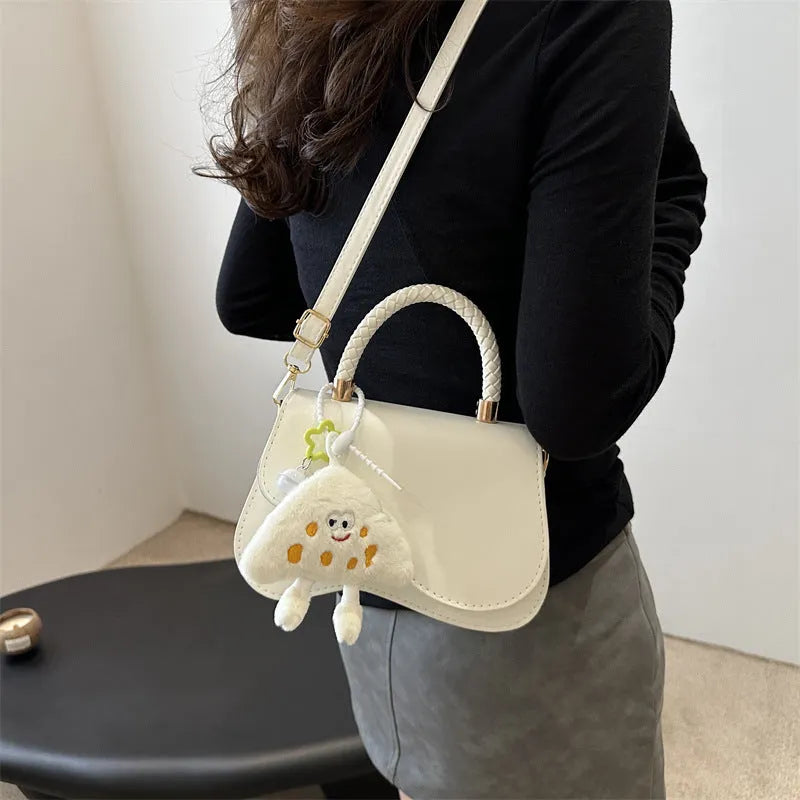 Soft PU one-shoulder bag with magnetic snap, horizontal square shape, shown in khaki with optional pendant.