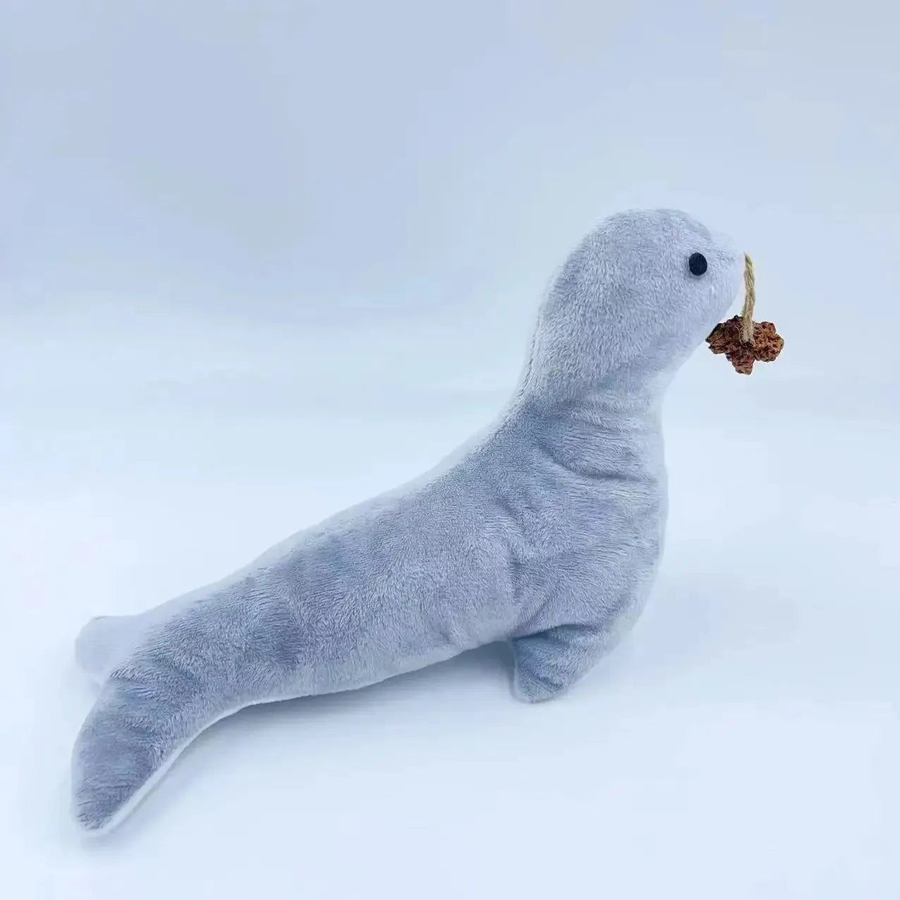 Blue sea lion plush cat toy containing bell and catnip for interactive play