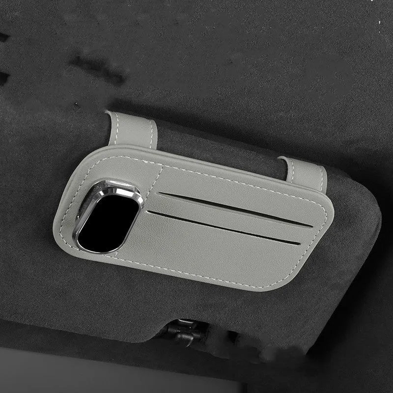 Genuine cowhide leather car sun visor holder with metal sunglasses clip and card storage slots.