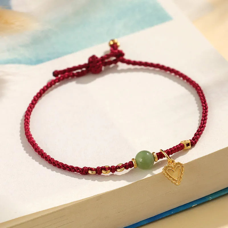 Handmade women's woven bracelet with 925 silver and Hetian jade in red strap option