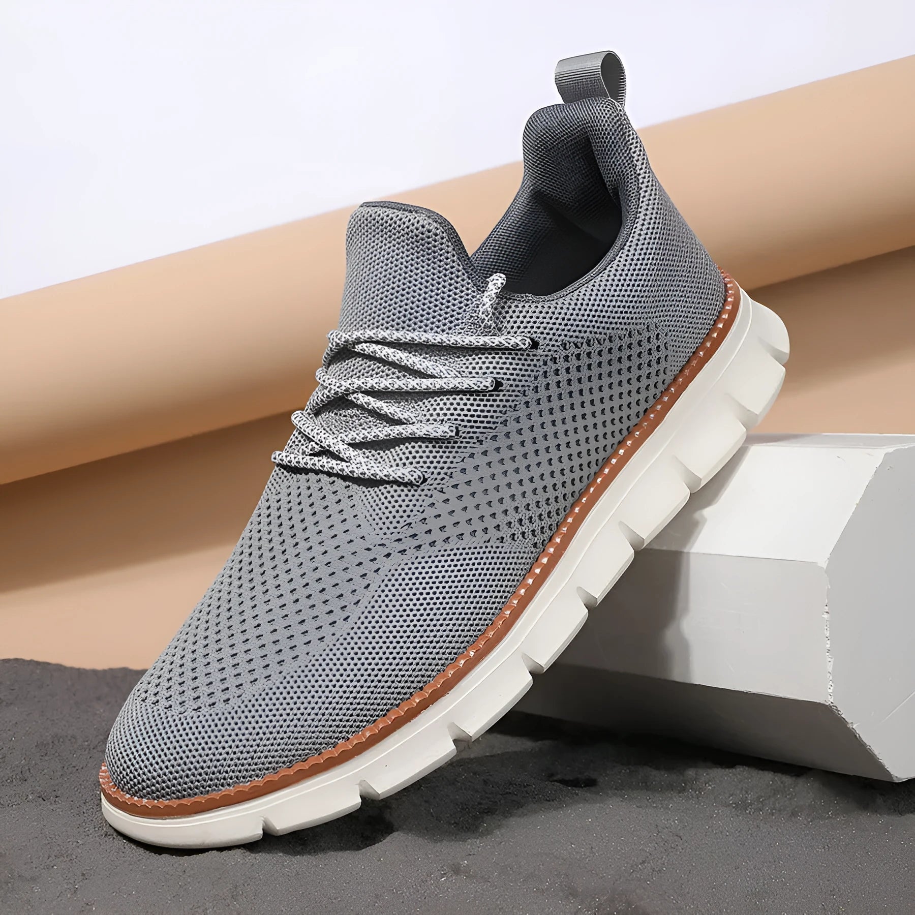 Men's grey mesh casual sneakers with round toe and low-cut design on a white background.