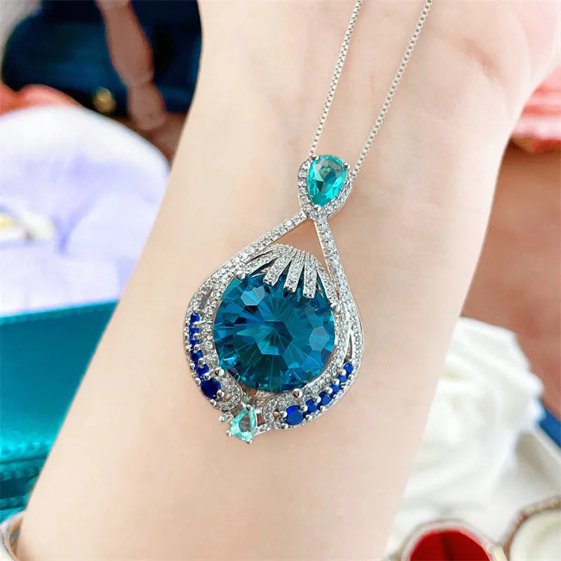 Women's geometric necklace with blue crystal gems on water wave chain