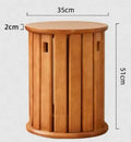 A stackable round metal dining stool in a modern style, shown in a choice of colours.