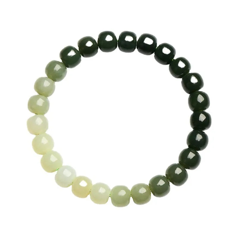 Natural Hetian jade bracelet showing gradient clear to water colour beads on elastic cord