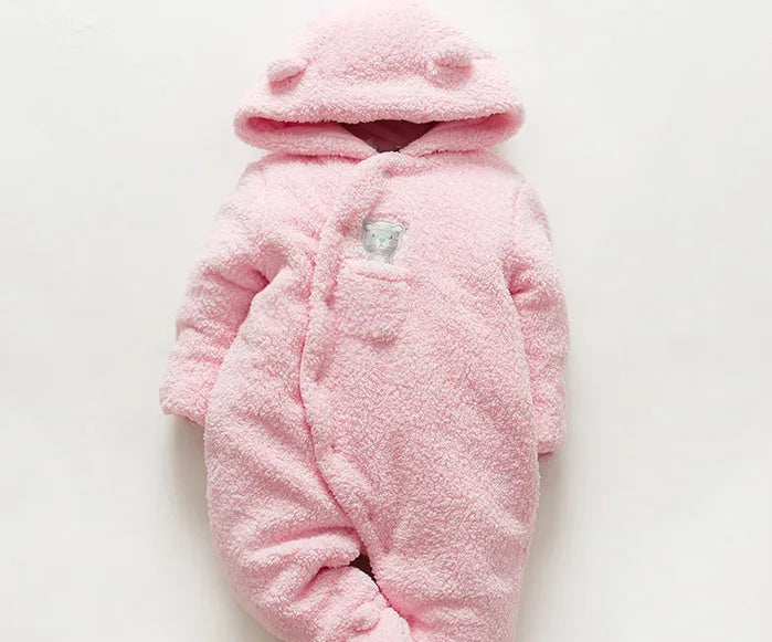 Baby wearing a white cotton padded lamb jumpsuit for winter